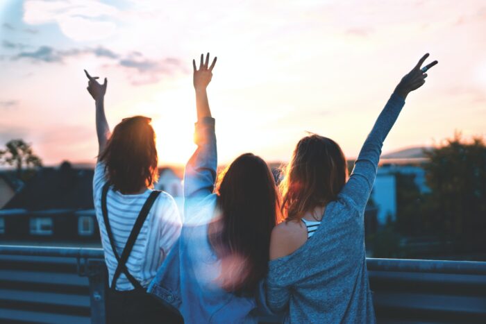 Three women celebrating being free of HPV